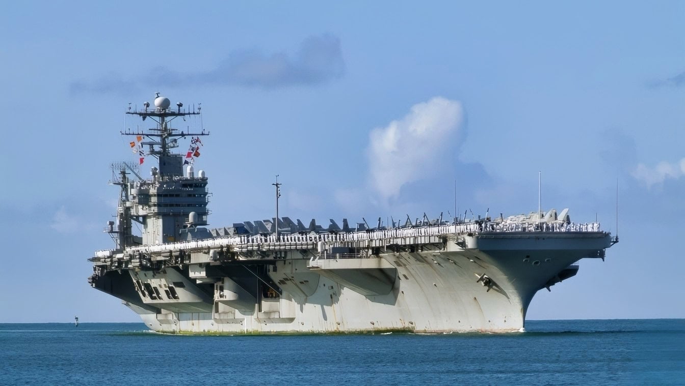 Pearl Harbor, Hawaii (Apr. 26, 2003) -- Spectators welcome the aircraft carrier, USS Abraham Lincoln (CVN 72) to Pearl Harbor. Lincoln is on its way home from a deployment spanning more than nine months. Abraham Lincoln is among the first ships to return home from Operation Iraqi Freedom. U.S. Navy photo by PhotographerÕs Mate 2nd Class Joshua L. Pritekel. (RELEASED)