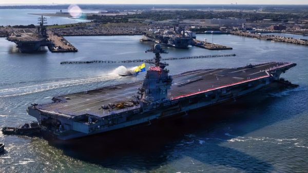 260516-N-FY193-1763 NORFOLK, Va. (May 16, 2026) USS Gerald R. Ford (CVN 78) returned to Naval Station Norfolk, May 16, 2026, following a historic 11-month deployment to U.S. 2nd, 4th, 5th, and 6th Fleets as part of the Gerald R. Ford Carrier Strike Group. Before returning to Norfolk after 326 days, the Gerald R. Ford crew conducted 23 replenishments-at-sea and sailed over 57,713 nautical miles. Embarked Carrier Air Wing 8 logged more than 5,760 flight hours and 12,200 flight launches. (U.S. Navy photo by Mass Communication Specialist 2nd Class Mike Shen)