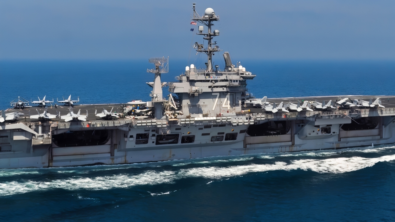 The aircraft carrier USS John C. Stennis (CVN 74) transits the Persian Gulf. John C. Stennis is deployed to the U.S. 5th Fleet area of responsibility conducting maritime security operations and support missions as part of Operations Enduring Freedom and New Dawn.