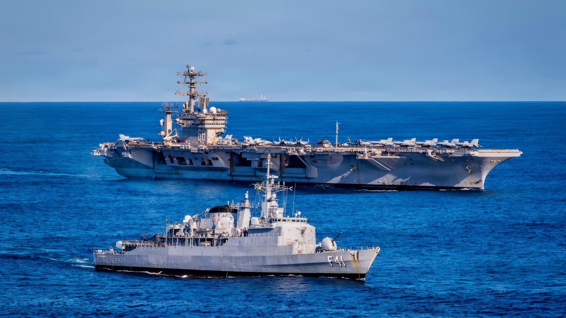 Brazilian Navy Niterói-class frigate Defensora (F 41), and U.S. Navy Nimitz-class aircraft carrier USS Nimitz (CVN 68), steam in formation alongside Nimitz-class aircraft carrier USS Nimitz (CVN 68), part of Nimitz Carrier Strike Group, during a bilateral maritime engagement in the Atlantic Ocean, May 13, 2026. Nimitz is deployed as part of Southern Seas 2026, which seeks to enhance capability, improve interoperability, and strengthen maritime partnerships with countries throughout the region through joint, multinational, and interagency exchanges and cooperation. (U.S. Navy photo by Mass Communication Specialist 3rd Class Gina Gallia)