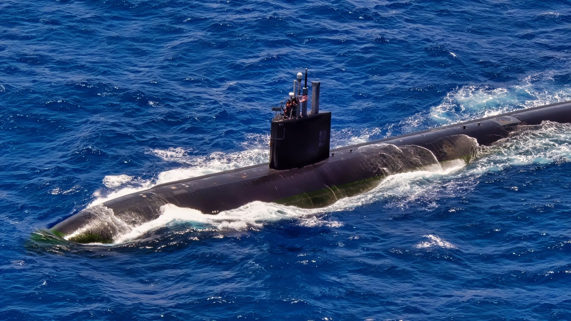 Virginia-class submarine USS North Carolina (SSN-777) sails during the at-sea phase of Exercise Rim of the Pacific (RIMPAC) 2024. Twenty-nine nations, 40 surface ships, three submarines, 14 national land forces, more than 150 aircraft and 25,000 personnel are participating in RIMPAC in and around the Hawaiian Islands, June 27 to Aug. 1. The world’s largest international maritime exercise, RIMPAC provides a unique training opportunity while fostering and sustaining cooperative relationships among participants critical to ensuring the safety of sea lanes and security on the world’s oceans. RIMPAC 2024 is the 29th exercise in the series that began in 1971. (U.S. Navy photo by Mass Communication Specialist 2nd Class Terrin Hartman)