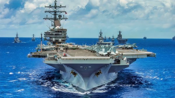 The aircraft carrier USS Ronald Reagan (CVN 76) leads a close formation of 42 ships and submarines from 15 international partner nations during Rim of the Pacific (RIMPAC) Exercise 2014. Twenty-two nations, 49 ships, six submarines, more than 200 aircraft and 25,000 personnel are participating in RIMPAC exercise from June 26 to Aug. 1, in and around the Hawaiian Islands. The world's largest international maritime exercise, RIMPAC provides a unique training opportunity that helps participants foster and sustain the cooperative relationships that are critical to ensuring the safety of sea lanes and security on the world's oceans. RIMPAC 2014 is the 24th exercise in the series that began in 1971. (U.S. Navy photo by Mass Communication Specialist 2nd Class Jacob Estes/Released)