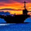 (Sept. 08, 2012) The forward deployed aircraft carrier USS George Washington (CVN 73) sails through calm seas near Guam at sunset. George Washington is the centerpiece of Carrier Strike Group FIVE, the US Navy’s only continuously forward deployed carrier strike group, based out of Yokosuka, Japan. Carrier Strike Group FIVE is currently on a routine Western Pacific patrol. (U.S. Navy photo by Mass Communication Specialist 3rd Class Paul Kelly/ Released)