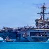 Nimitz-class aircraft carrier USS Theodore Roosevelt (CVN 71) departs Joint Base Pearl Harbor-Hickam, Hawaii, during Exercise Rim of the Pacific 2026, July 7, 2026. Thirty nations, over 30 surface ships, five submarines, 15 national land forces, more than 206 aircraft and 30,000 personnel are participating in RIMPAC in and around the Hawaiian Islands, June 24 to July 31. The world's largest international maritime exercise, RIMPAC provides a unique training opportunity while fostering and sustaining cooperative relationships among participants critical to ensuring the safety of sea lanes and security on the world's oceans. RIMPAC 2026 is the 30th exercise in the series that began in 1971. (U.S. Navy photo by Mass Communications Specialist First Class Luke McCall)