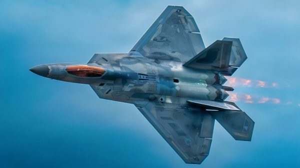 Afterburners are lit as an F-22 Raptor performs at the Cold Lake Airshow in Cold Lake, Alberta, Canada, July 18, 2026. Powered by two Pratt & Whitney F119 engines producing a combined 70,000 pounds of thrust, the aircraft showcases unmatched speed, maneuverability, and air dominance capability. (U.S. Air Force photo by Staff Sgt. Lauren Diaz)