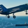 An F-35 test pilot from Air Test and Evaluation Squadron Two Three (VX-23), Naval Air Warfare Center Aircraft Division (NAWCAD), flies an F-35C Lightning II fighter aircraft to the PCU John F. Kennedy (CVN 79) in the Western Atlantic Oct. 13, 2026. This is the first time an F-35C has landed on a Ford-class aircraft carrier. A Patuxent River F-35 Integrated Test Force (ITF) team detached to the ship is conducting Aircraft Compatibility Testing (ACT) with the specially instrumented carrier variant of the stealth jet. ACT assesses the operational capabilities of the ship's aircraft launch and recovery equipment with U.S. Navy aircraft.