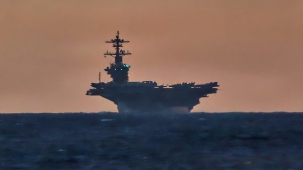Nimitz-class aircraft carrier USS Abraham Lincoln (CVN 72), right, and Ticonderoga-class guided-missile cruiser USS Robert Smalls (CG 62) sail in the South China Sea, Sept. 14, 2026. Frank E. Petersen Jr. is underway conducting routine operations in the U.S. 7th Fleet area of operations. Units assigned to 7th Fleet conduct continuous patrols to deter aggression, strengthen alliances and partnerships, and advance peace through strength. (U.S. Navy photo by Mass Communication Specialist 2nd Class Nathaly Cruz)