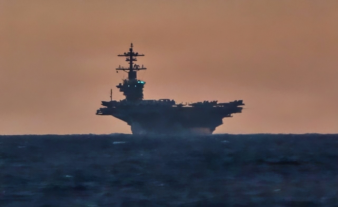 Nimitz-class aircraft carrier USS Abraham Lincoln (CVN 72), right, and Ticonderoga-class guided-missile cruiser USS Robert Smalls (CG 62) sail in the South China Sea, Sept. 14, 2026. Frank E. Petersen Jr. is underway conducting routine operations in the U.S. 7th Fleet area of operations. Units assigned to 7th Fleet conduct continuous patrols to deter aggression, strengthen alliances and partnerships, and advance peace through strength. (U.S. Navy photo by Mass Communication Specialist 2nd Class Nathaly Cruz)