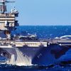 Atlantic Ocean (Feb. 6, 2006)-- The Guided-Missle Destroyer USS MCFAUL (DDG 74) steams alongside the nuclear-powered aircraft carrier USS ENTERPRISE (CVN 65) for a refueling at sea. ENTERPRISE is currently underway in the Atlantic Ocean conducting carrier qualifications. Official US Navy photo by Photographer's Mate 3rd Class Josh Kinter.