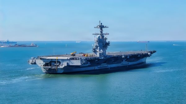 The future USS John F. Kennedy (CVN 79) transits to Naval Station Norfolk, Virginia, October 2, 2026, following her departure from HII's Newport News Shipbuilding division in Newport News, Virginia, after four days at sea. John F. Kennedy is the second Gerald R. Ford-class aircraft carrier, representing the next generation of U.S. Navy aircraft carrier capabilities and supporting the Navy's commitment to maintaining maritime superiority and global readiness. (U.S. Navy photo by Mass Communication Specialist 2nd Class Julianna Lynch)